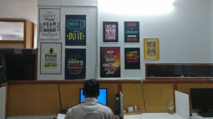 Office quotes, man working on computer